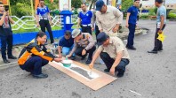 Peringati HUT Lantas AKP Eri Asman Pimpin Pengecatan Marka Jalan